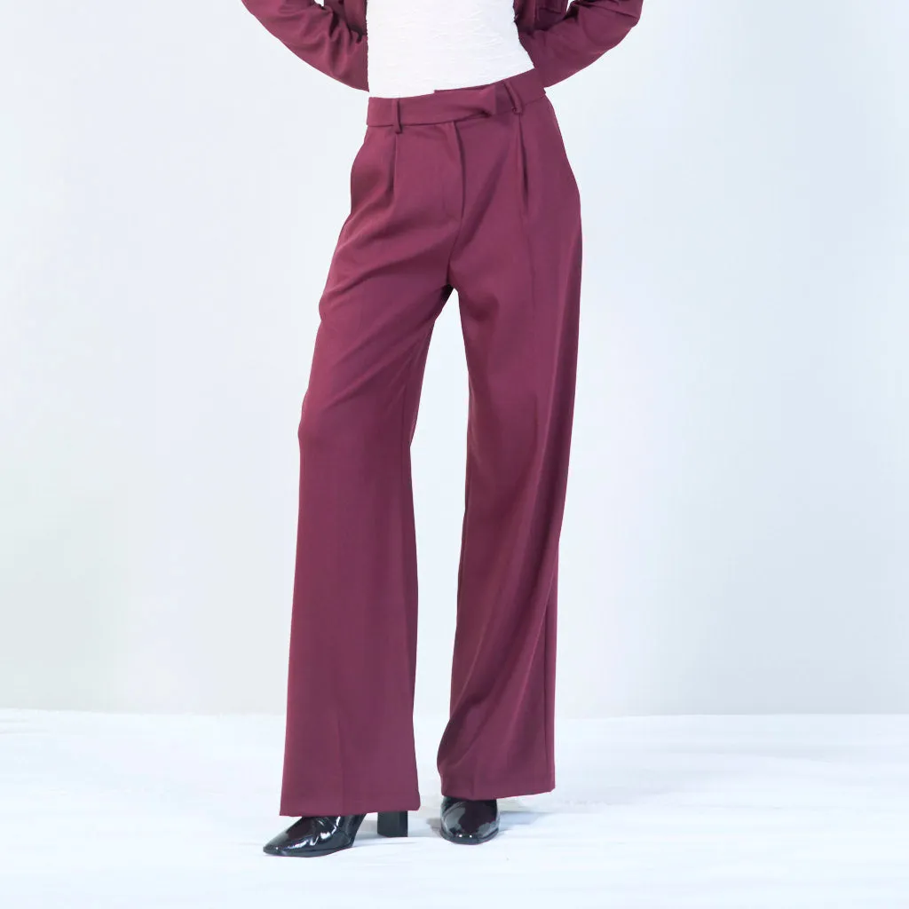 High-waisted trousers with pleated front and button detail wholesale