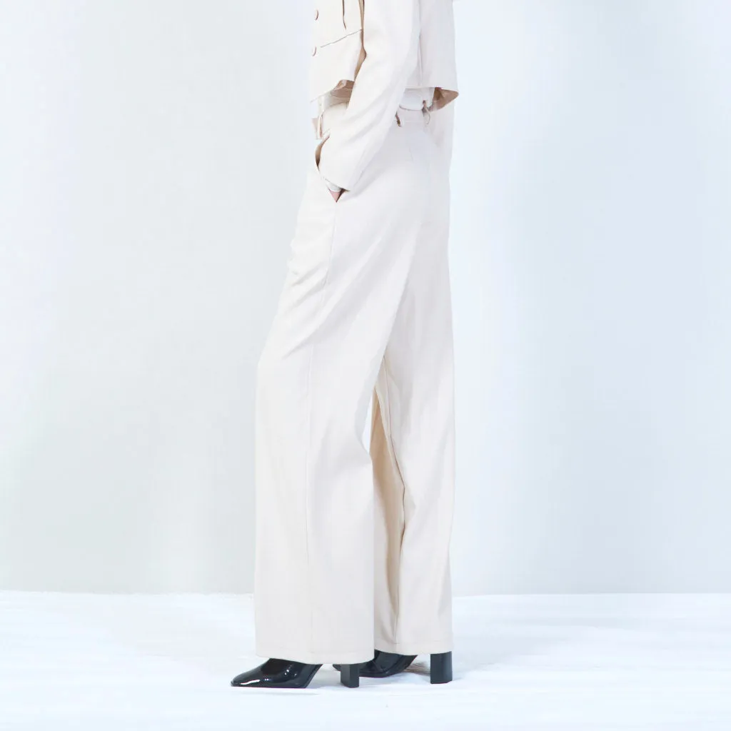 High-waisted trousers with pleated front and button detail wholesale