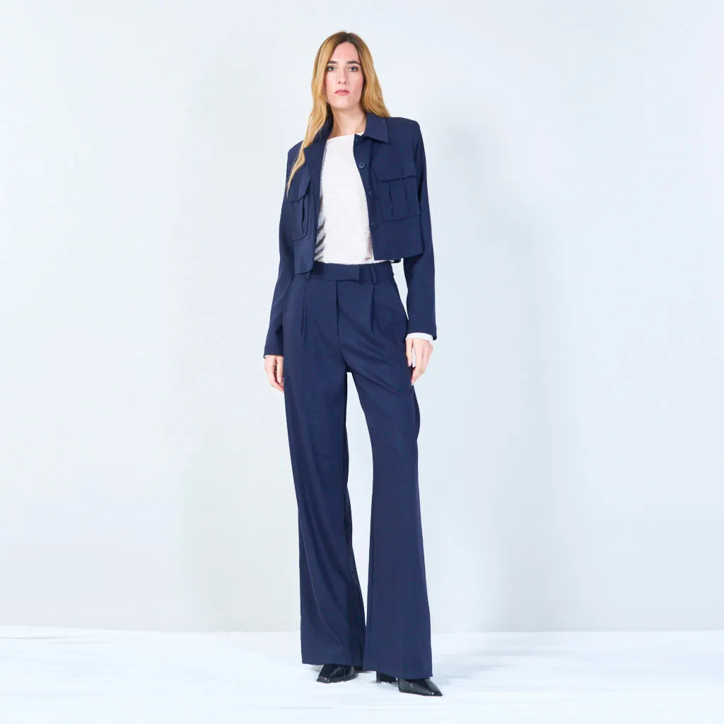 High-waisted trousers with pleated front and button detail wholesale