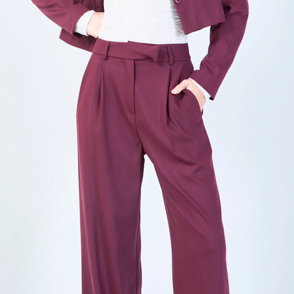 High-waisted trousers with pleated front and button detail wholesale