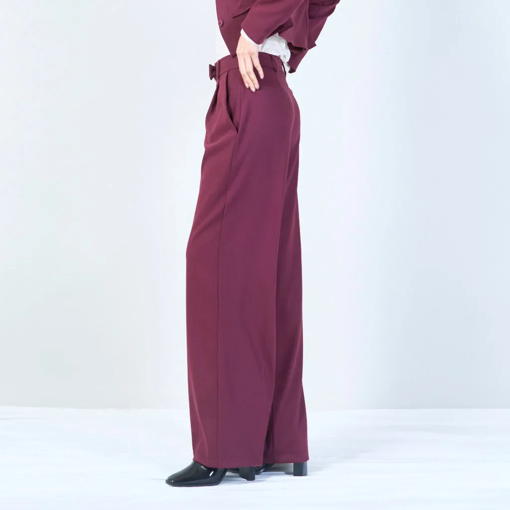 High-waisted trousers with pleated front and button detail wholesale