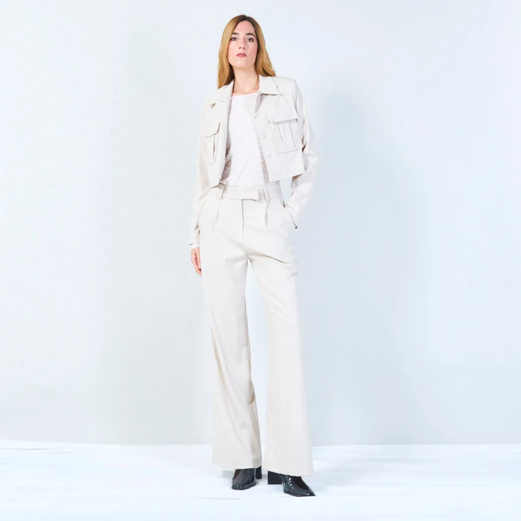 High-waisted trousers with pleated front and button detail wholesale